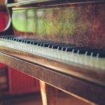 an old grand piano in the sunlight