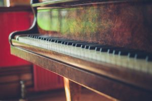 an old grand piano in the sunlight